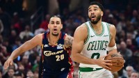 Boston Celtics forward Jayson Tatum (0) drives to the basket against Cleveland Cavaliers guard Jaylon Tyson (20) during the first half at Rocket Arena.