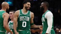 Boston Celtics forward Jayson Tatum (0) has a laugh with guard Jaylen Brown (7) during the second half against the Dallas Mavericks at TD Garden.