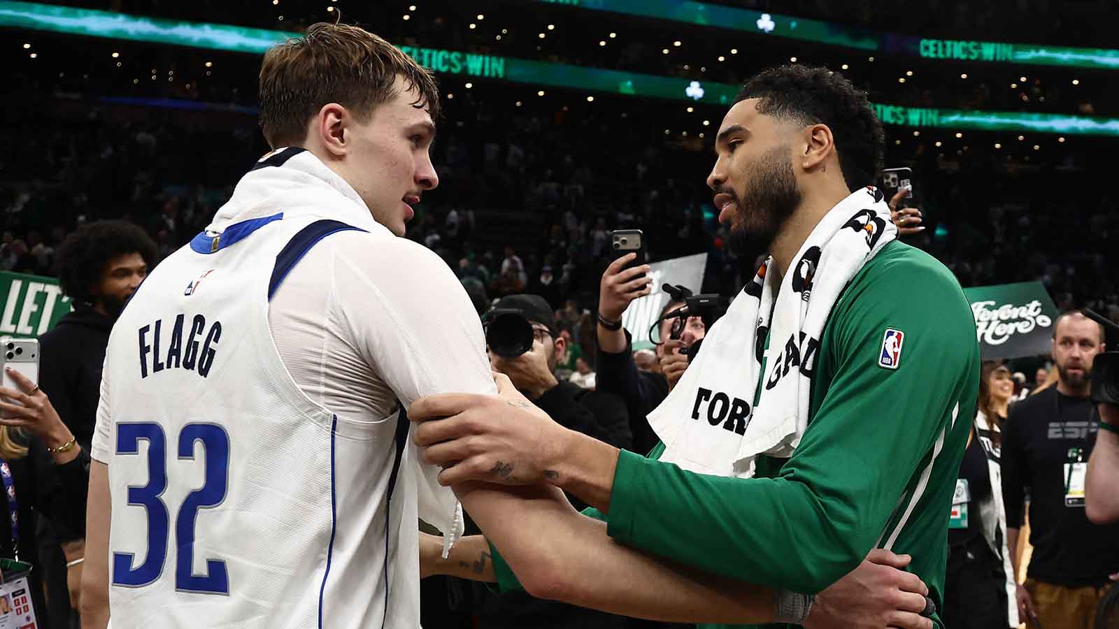 Boston Celtics forward Jayson Tatum (0) and Dallas Mavericks forward Cooper Flagg (32) talk after their game at TD Garden.
