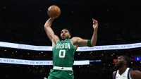 Boston Celtics forward Jayson Tatum (0) goes to the basket past Dallas Mavericks center Moussa Cisse (30) during the second quarter at TD Garden.