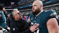 Philadelphia Eagles assistant coach Jeff Stoutland (L) and offensive tackle Lane Johnson (65) in the final minute of a victory in the NFC Championship game against the Washington Commanders at Lincoln Financial Field.