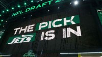 The New York Jets logo is projected on the video board during the NFL Draft at Lambeau Field.