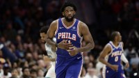 Philadelphia 76ers center/forward Joel Embiid (21) runs down the court during the fourth quarter against the Charlotte Hornets at Spectrum Center.