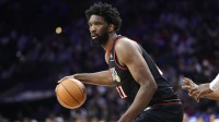 Philadelphia 76ers center Joel Embiid (21) controls the ball against the Miami Heat during the third quarter at Xfinity Mobile Arena.