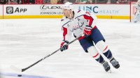 Washington Capitals defenseman John Carlson (74) skates with the puck against the Carolina Hurricanes during the first period at Lenovo Center.