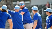 Toronto Blue Jays manager John Schneider (14) talks with a group of players before the start of the game against the Atlanta Braves during spring training at CoolToday Park.