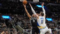 San Antonio Spurs forward Keldon Johnson (3) shoots against Indiana Pacers center Micah Potter (11) in the second half at Frost Bank Center.