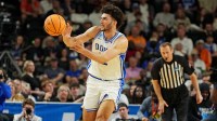 Duke Blue Devils forward Cameron Boozer (12) drives to the basket during the second half against the Texas Christian University Horned Frogs during a second round game of the men's 2026 NCAA Tournament at Bon Secours Wellness Arena.