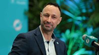 Miami Dolphins general manager Jon-Eric Sullivan reacts during his introductory press conference at Baptist Health Training Complex.