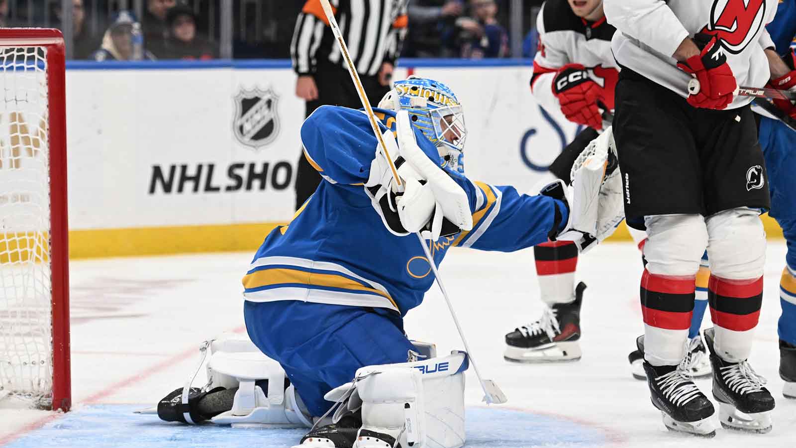 St. Louis Blues goaltender Jordan Binnington (50) makes a glove save against the New Jersey Devils in the third period at Enterprise Center.