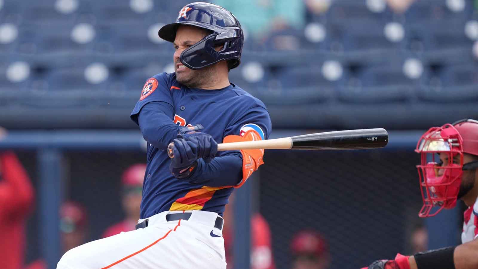 Houston Astros left fielder Jose Altuve (27) hits a single in the first inning against the Washington Nationals at CACTI Park of the Palm Beaches.