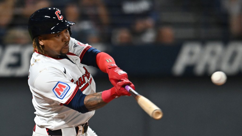 Cleveland Guardians third baseman Jose Ramirez (11) hits a single against the Texas Rangers during the first inning at Progressive Field