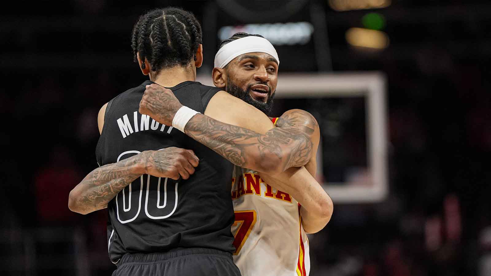 Brooklyn Nets forward Josh Minott (00) and Atlanta Hawks guard Nickeil Alexander-Walker (7) react after the Hawks defeated the Brooklyn Nets at State Farm Arena.