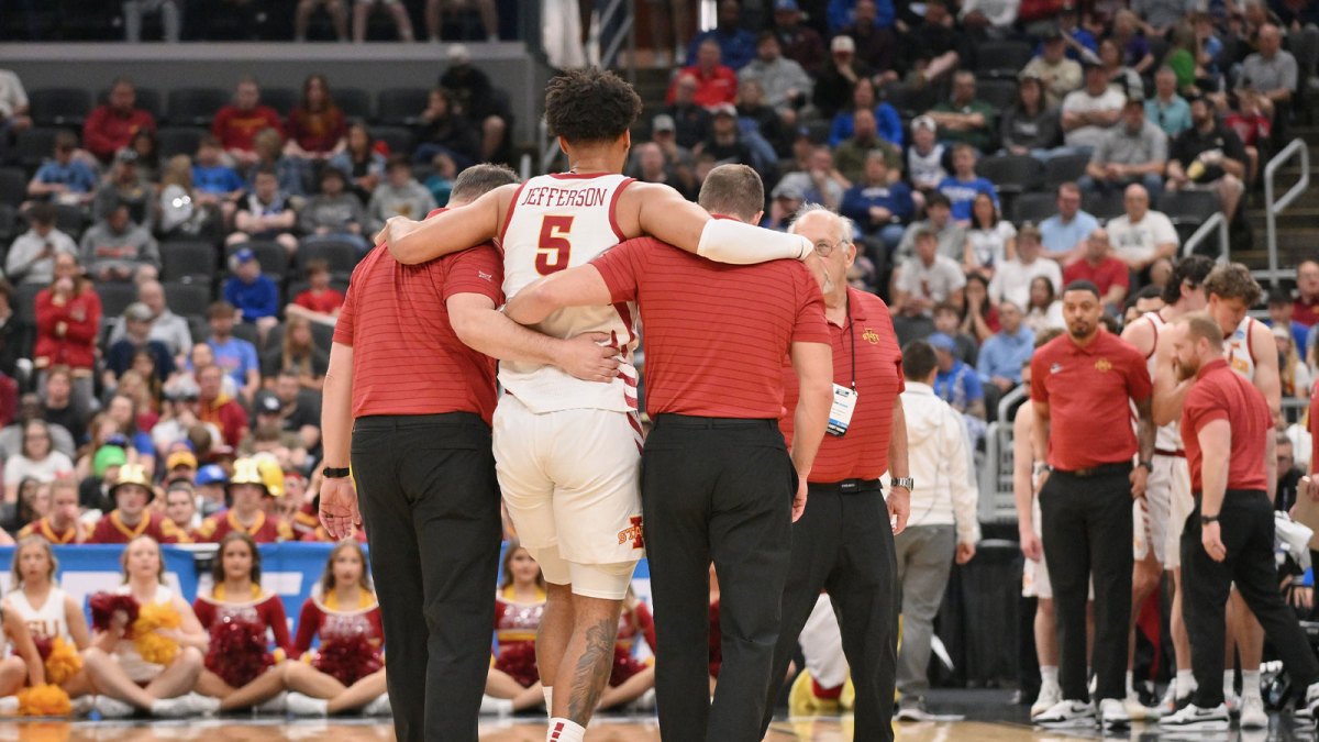 Iowa State Cyclones forward Joshua Jefferson (5) is helped off of the court after suffering an apparent injury to his left leg against Tennessee State Tigers during the first half of a first round game of the men's 2026 NCAA Tournament at Enterprise Center.