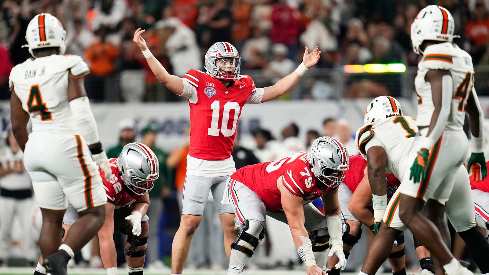 Ohio State Buckeyes quarterback Julian Sayin (10) motions during the Cotton Bowl at AT&T Stadium in Arlington, Texas for the College Football Playoff quarterfinal game against the Miami Hurricanes on Dec. 31, 2025. Ohio State lost 24-14.