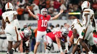 Ohio State Buckeyes quarterback Julian Sayin (10) motions during the Cotton Bowl at AT&T Stadium in Arlington, Texas for the College Football Playoff quarterfinal game against the Miami Hurricanes on Dec. 31, 2025. Ohio State lost 24-14.