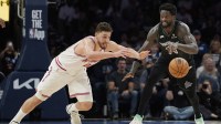 Houston Rockets center Alperen Sengun (28) challenges Minnesota Timberwolves forward Julius Randle (30) for the ball in the fourth quarter at Target Center.