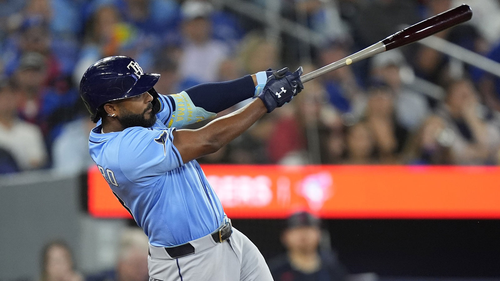 Tampa Bay Rays third baseman Junior Caminero (13) hits a single against the Toronto Blue Jays during the eighth inning at Rogers Centre. 