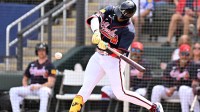 Atlanta Braves designated hitter Jurickson Profar (17) hits a sacrifice fly to drive in a run in the first inning against the Boston Red Sox during spring training at CoolToday Park.