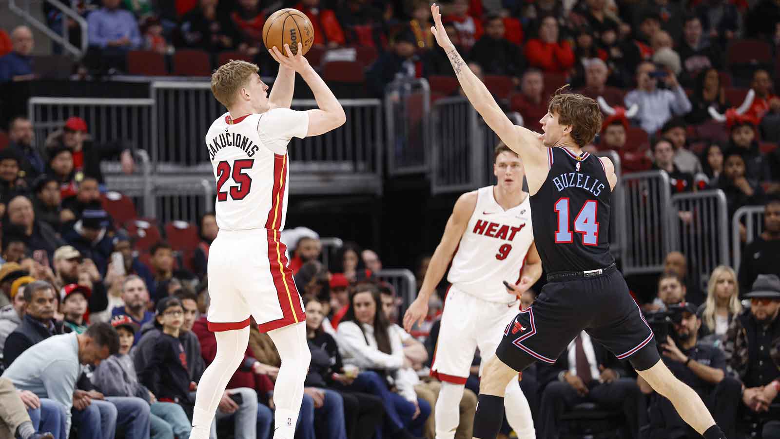 Miami Heat guard Kasparas Jakucionis (25) shoots against Chicago Bulls forward Matas Buzelis (14) during the first half at United Center.