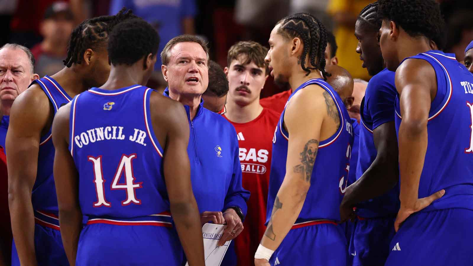 Kansas Jayhawks head coach Bill Self (center) in the huddle with his players against the Arizona State Sun Devils in the first half at Desert Financial Arena.