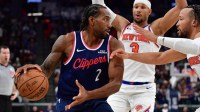 Los Angeles Clippers forward Kawhi Leonard (2) controls the ball against New York Knicks guard Jalen Brunson (11) and guard Josh Hart (3) during the second half at Intuit Dome.