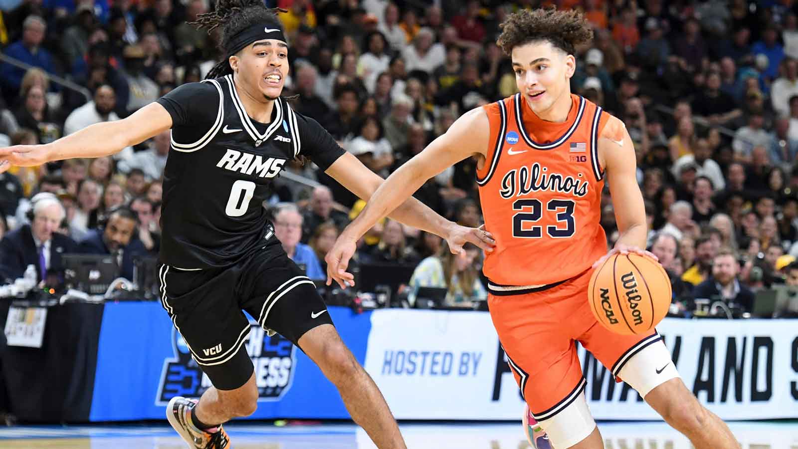 VCU Rams guard Brandon Jennings (0) defends Illinois Fighting Illini guard Keaton Wagler (23) Saturday, March 21, 2026, during the NCAA Men’s Basketball Tournament second round game at Bon Secours Wellness Arena in Greenville, South Carolina.