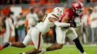Miami (FL) Hurricanes defensive back Keionte Scott (0) works to bring down Indiana Hoosiers tight end Riley Nowakowski (37) on Monday, Jan. 19, 2026, during the College Football Playoff National Championship college football game at Hard Rock Stadium in Miami Gardens.