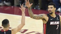 Miami Heat center Kel'el Ware (7) celebrates his three-point basket with guard Tyler Herro (14) in the fourth quarter against the Cleveland Cavaliers at Rocket Arena.