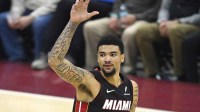 Miami Heat center Kel'el Ware (7) celebrates his three-point basket in the fourth quarter against the Cleveland Cavaliers at Rocket Arena.