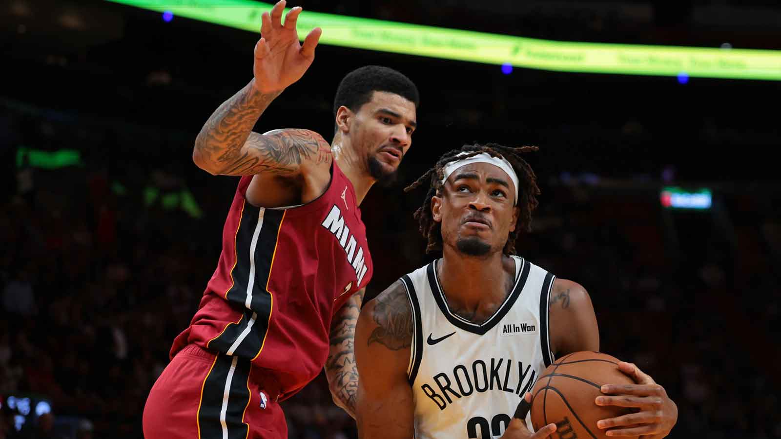 Brooklyn Nets center Nic Claxton (33) drives to the basket against Miami Heat center Kel'el Ware (7) during the second quarter at Kaseya Center.