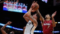Miami Heat center Kel'el Ware (7) blocks the shot of Brooklyn Nets forward Michael Porter Jr. (17) during the first quarter at Kaseya Center.
