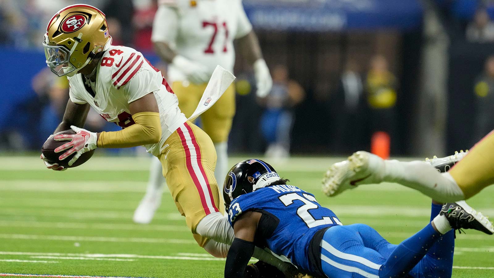Indianapolis Colts cornerback Kenny Moore II (23) trips up San Francisco 49ers wide receiver Kendrick Bourne (84) on Monday, Dec. 22, 2025, during a game at Lucas Oil Stadium in Indianapolis.