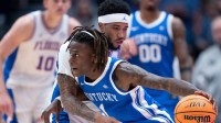 Kentucky guard Denzel Aberdeen (1) is guarded by Florida guard Boogie Fland (0) during their quarterfinal game of the 2026 SEC Men’s Basketball Tournament at Bridgestone Arena in Nashville, Tenn.