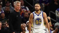 Warriors guard Stephen Curry (30) reacts alongside head coach Steve Kerr