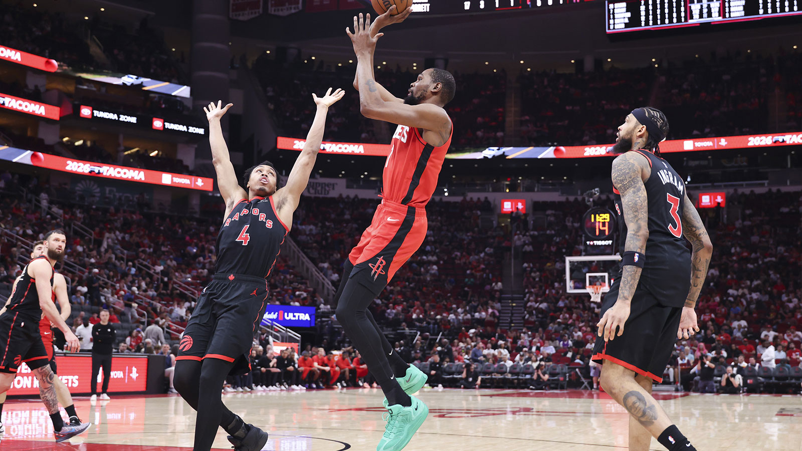 Houston Rockets forward Kevin Durant (7) shoots the ball as Toronto Raptors forward Scottie Barnes (4) defends during the third quarter at Toyota Center. 