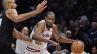 Houston Rockets forward Kevin Durant (7) goes to the basket against Minnesota Timberwolves center Rudy Gobert (27) in the third quarter at Target Center.