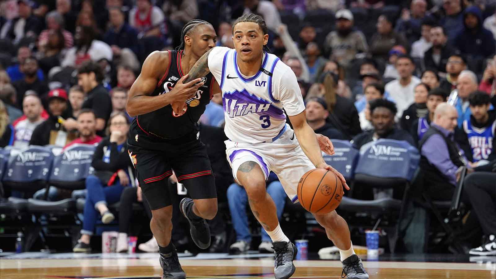Utah Jazz guard Keyonte George (3) drives against Philadelphia 76ers guard Tyrese Maxey (0) in the third quarter at Xfinity Mobile Arena.