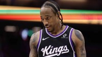 Kings forward/guard DeMar DeRozan (10) between plays against the Charlotte Hornets during the fourth quarter at Golden 1 Center with Tim Duncan in the background