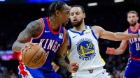 Kings DeMar DeRozan (10) dribbles vs. Warriors' Stephen Curry