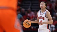 Houston Cougars guard Kingston Flemings (4) dribbles the ball against the Illinois Fighting Illini in the first half during a Sweet Sixteen game of the South Regional of the men's 2026 NCAA Tournament at Toyota Center.