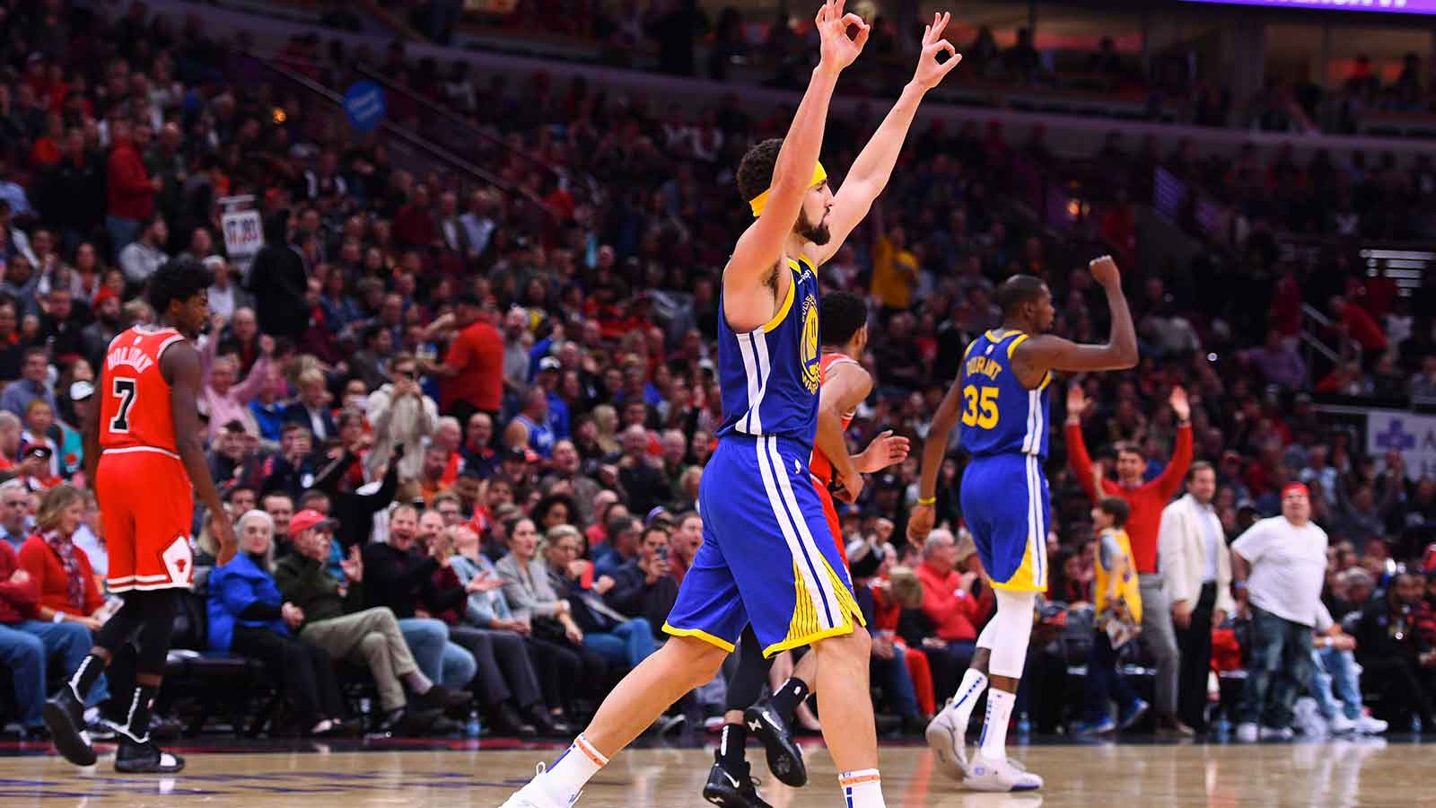 Golden State Warriors guard Klay Thompson (11) reacts after making a basket against the Chicago Bulls during the second half at the United Center.