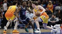 Charlotte Hornets guard/forward Kon Knueppel (7) drives past Memphis Grizzlies guard Javon Small (10) during the second quarter at Spectrum Center.