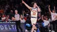 New York Knicks guard Tyler Kolek (13) reacts after making a three point basket during the second half against the Washington Wizards at Madison Square Garden.
