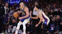 Golden State Warriors forward Gui Santos (15) controls the ball against New York Knicks guard Landry Shamet (44) during the fourth quarter at Madison Square Garden.