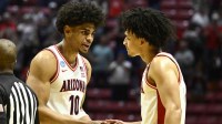 Arizona Wildcats forward Koa Peat (10) celebrates with guard Brayden Burries (5) after defeating the Utah State Aggies during a second round game of the men's 2026 NCAA Tournament at Viejas Arena.