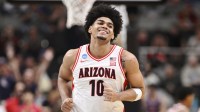 Arizona Wildcats forward Koa Peat (10) reacts after a pay against the Arkansas Razorbacks in the second half during a Sweet Sixteen game of the West Regional of the men's 2026 NCAA Tournament at SAP Center.