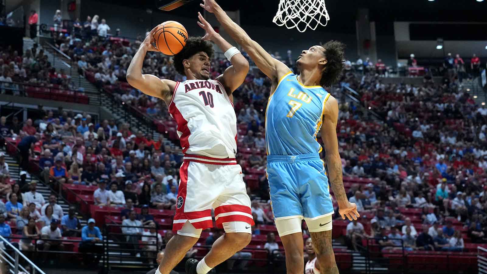 Arizona Wildcats forward Koa Peat (10) controls the ball against LIU Sharks center Isaiah Miranda (7) in the first half during a first round game of the men's 2026 NCAA Tournament at Viejas Arena.