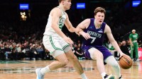 Charlotte Hornets guard Kon Knueppel (7) controls the ball while Boston Celtics guard Hugo Gonzalez (28) defends during the second half at TD Garden.