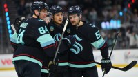 The Seattle Kraken celebrate after a goal scored against the Pittsburgh Penguins by Seattle Kraken right wing Eeli Tolvanen (20) during the third period at Climate Pledge Arena.